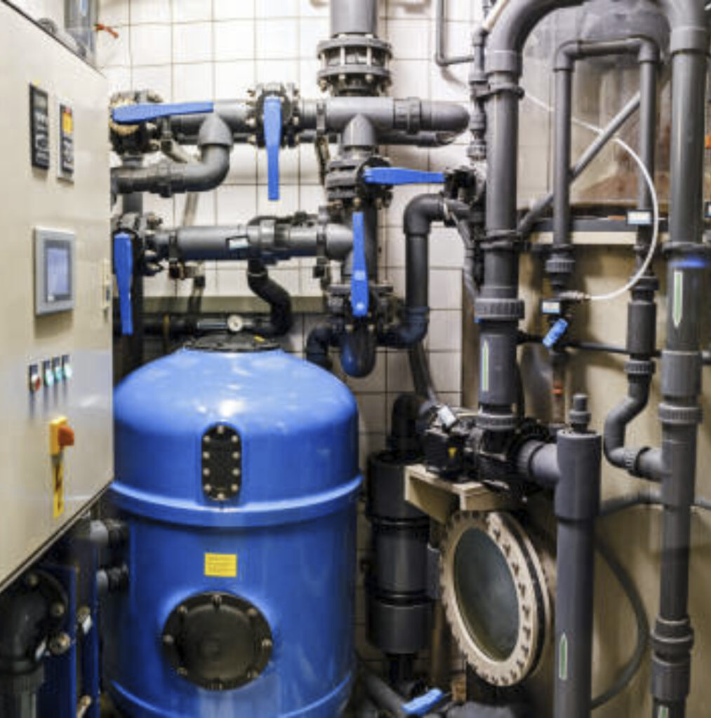 Blue cylindrical tank with industrial piping